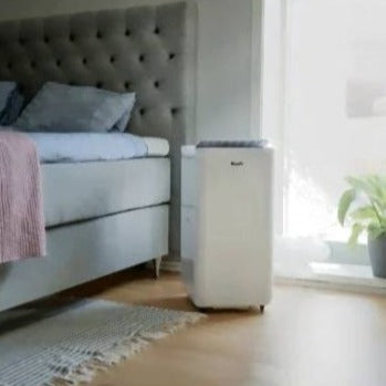 Woods Milan 7K Air Conditioner showing unit in bedroom situation from Bright Air