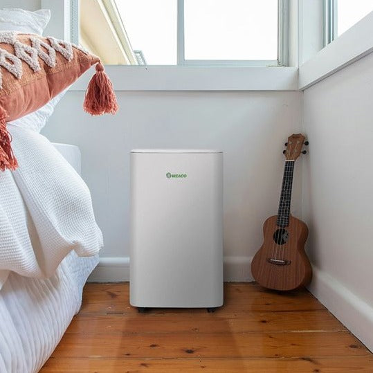 MeacoCool MC Series Pro 16000 CH BTU Portable Air Conditioner shown in bedroom situation from Bright Air